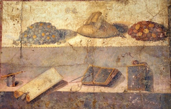Moedas e material romano para escrita e leitura